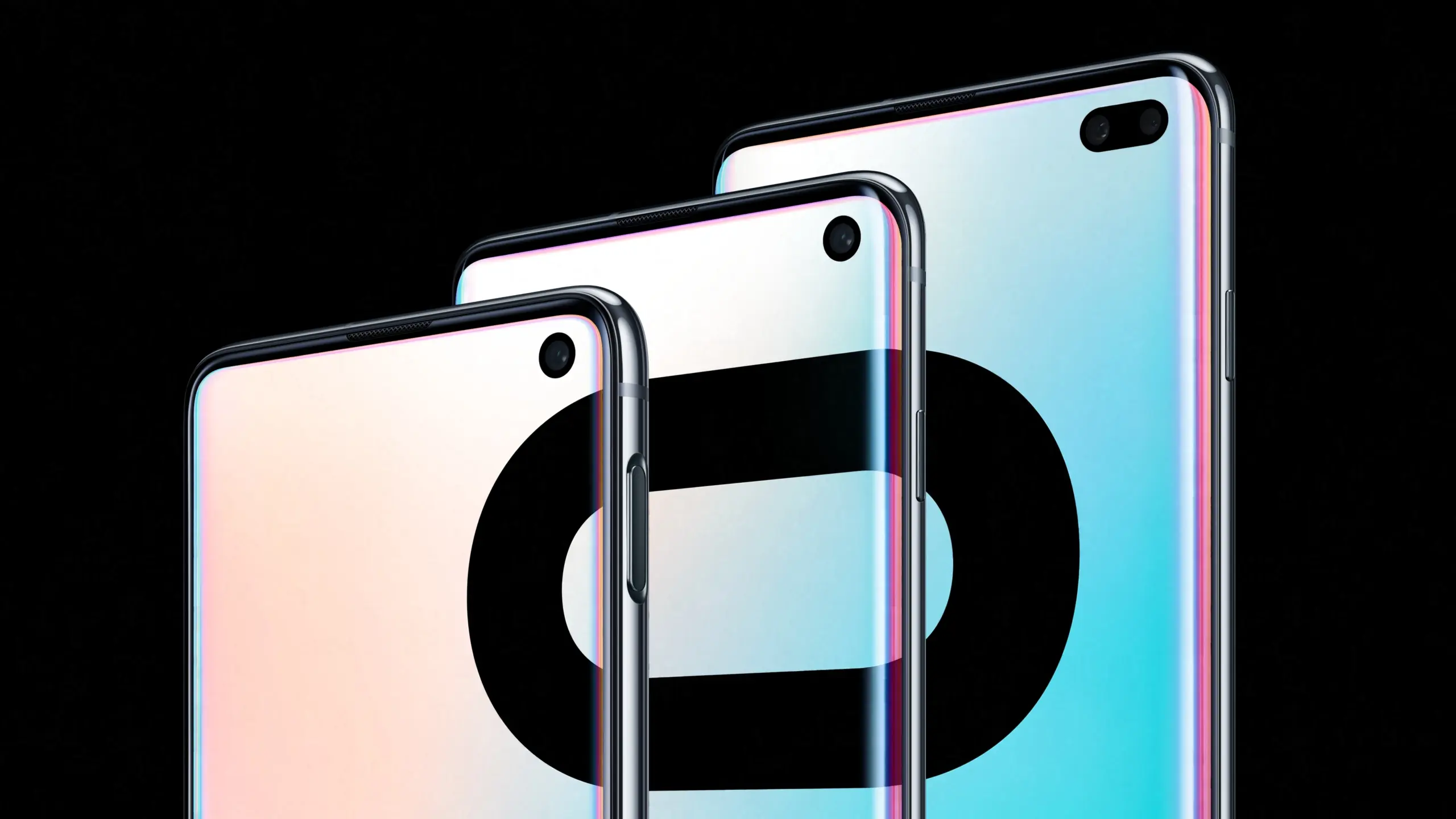 Three sleek smartphones arranged diagonally, showing edge-to-edge screens and glossy rounded backs against a black background.