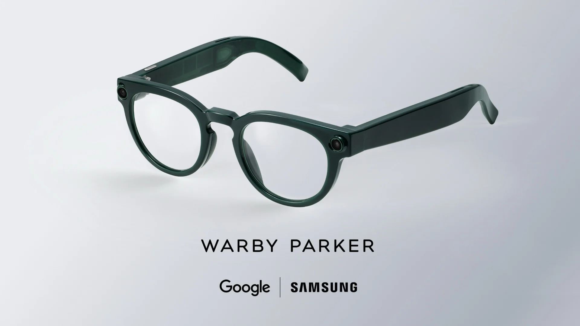 Dark green round eyeglasses on a light background with branding text below (Warby Parker, Google, Samsung).