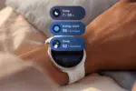 Smartwatch on wrist showing health metrics: sleep duration and energy scores in blue rounded panels