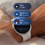 Smartwatch on wrist showing health metrics: sleep duration and energy scores in blue rounded panels