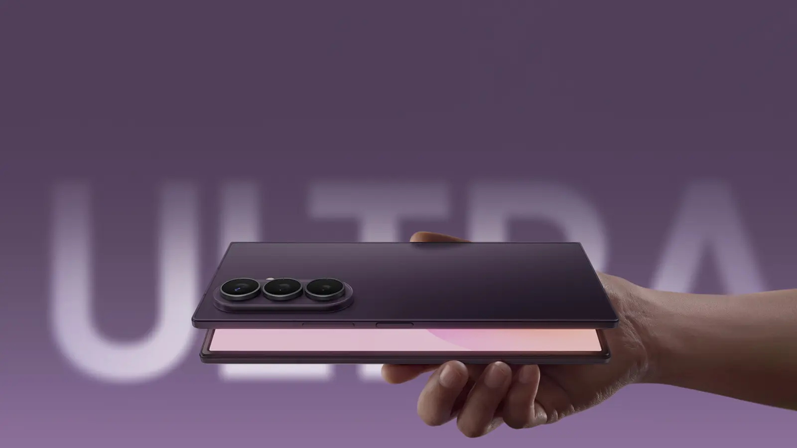 Hand holding a foldable smartphone with a triple-camera array against a purple background.
